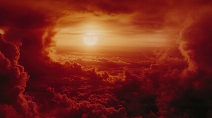 Fototapeta premium Fiery sunset viewed from above the clouds.
