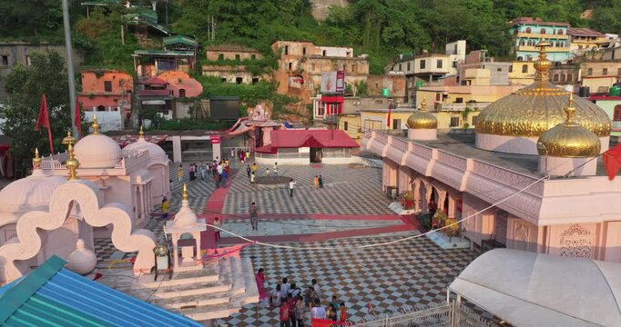 Aerial view capturing the Jawalamukhi Temple complex from the main entrance, extending toward the rear, highlighting the temple&rsquo;s golden domes and surrounding sacred landscape.