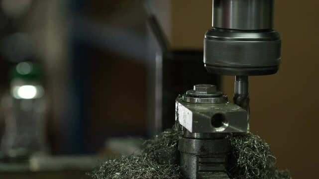 VDO 4K Lathe is working on turning metal parts for industrial use.