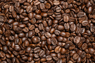 Decaffeinated coffee beans roasted close up top view