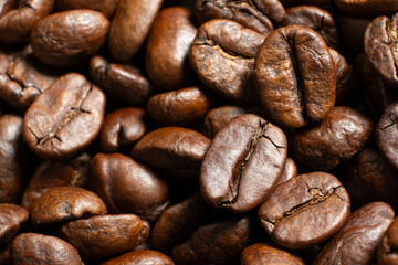 Freshly roasted coffee beans macro photography.