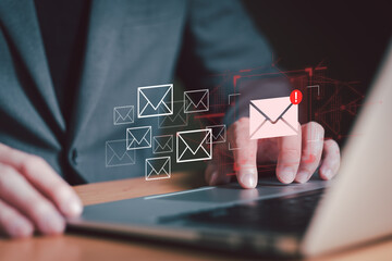 Business man using smartphone and computer that show warning sign after got attack phishing email by malware from hacker that commit cyber crime or software crash to cause an error.