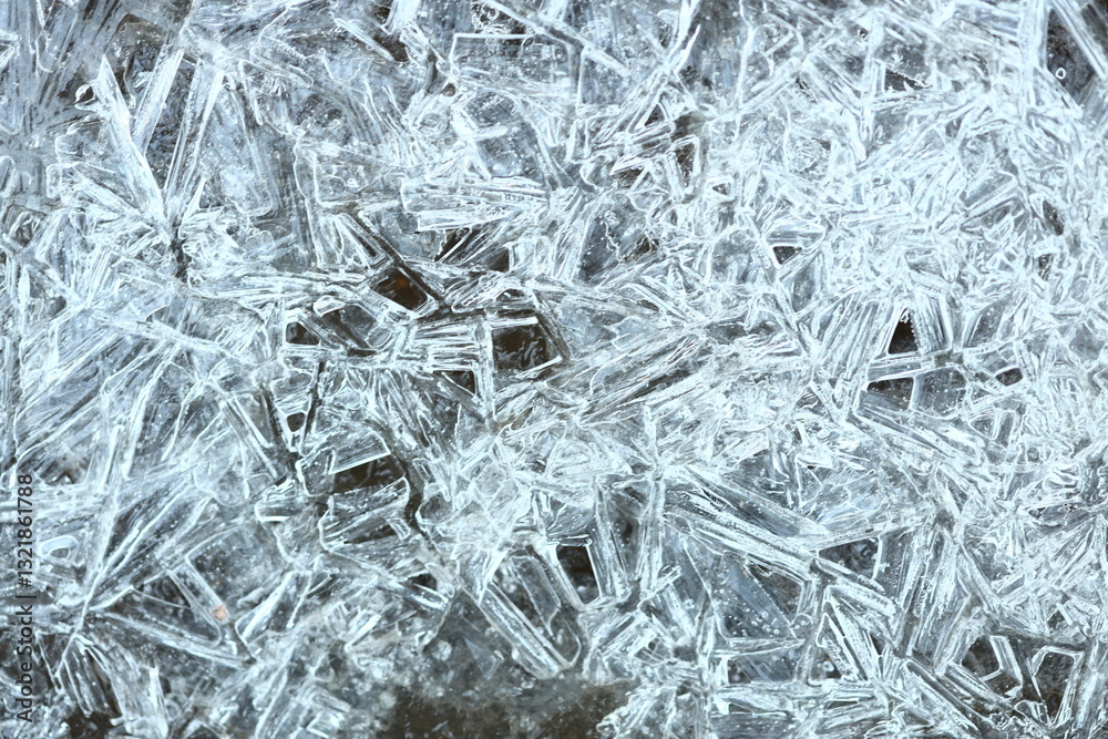 Poster a close-up view of a cluster of ice crystals, often found in cold weather conditions.