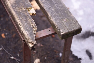 A close-up shot of a wooden bench covered in snow, ideal for winter scenes or festive decorations.