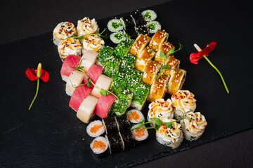 A variety of beautifully presented sushi with fresh ingredients and elegant garnishes