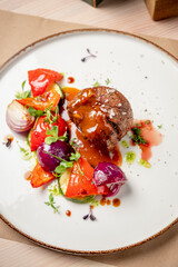 A stunning dish features tender beef, vibrant veggies, and rich sauce, inviting you to savor