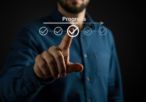 businessman touching virtual button digital progress checklist featuring check marks and a loading bar, representing task completion and project advancement, tracking strategies, and workflow