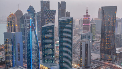 The skyline of the West Bay area from top in Doha day to night timelapse, Qatar.