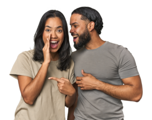Young Latino couple in studio saying a gossip, pointing to side reporting something.