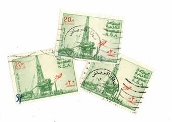 Vintage used postage stamps from Saudi Arabia featuring an oil rig.