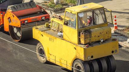 Large view on the road rollers working on the new road construction site timelapse