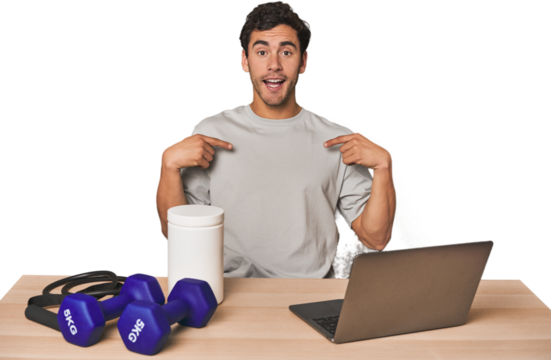 Hispanic trainer planning workout surprised pointing with finger, smiling broadly.