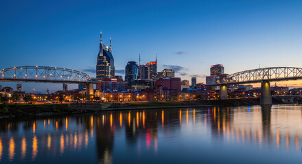 Obraz premium Nashville Skyline at Dusk: Cumberland River Lights & City Bridges - Tennessee Nightscape