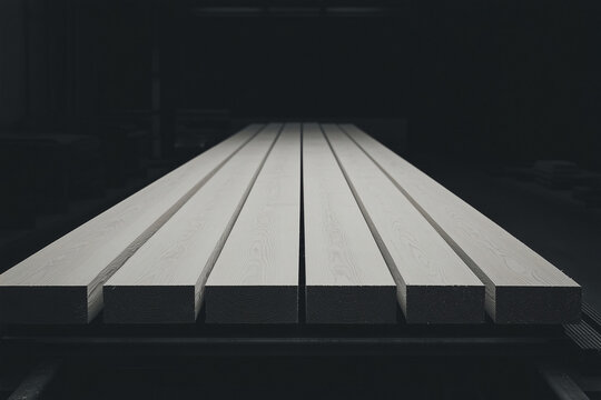 Monochromatic Lumber Display: An abstract study in form and texture, with a line of meticulously arranged wooden beams, their stark geometry set against a somber background. 