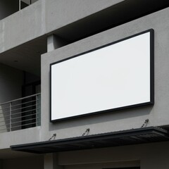 Fototapeta premium A photograph of a modern, minimalist building facade featuring a large, rectangular, white signage panel with a black frame, showcasing a poster mockup.