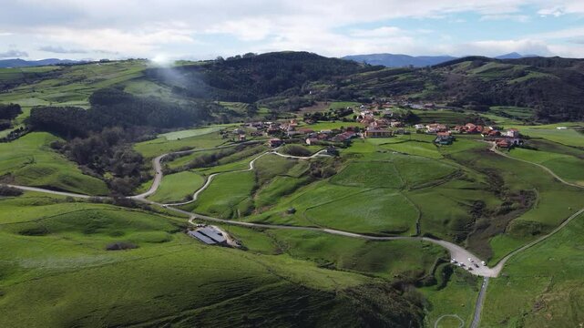 Aerial View of Cantabrian Coast to Picos de Europa - Panoramic aerial shot of Cantabria's coastline stretching towards the majestic Picos de Europa mountains.
