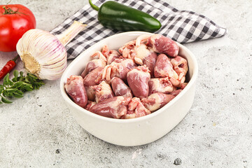 Fresh raw chicken hearts in the bowl