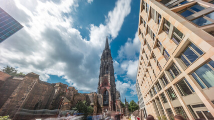 Looking up perspective to the facade of Ehemalige Hauptkirche St. Nikolai timelapse hyperlapse in Hamburg, Germany