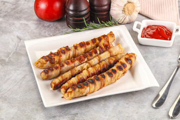 Grilled meat sausages wrapped bacon