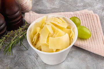 Parmesan cheese slices in the bowl