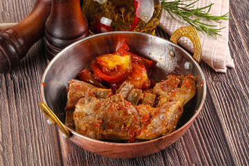 Baked lamb ribs with vegetables