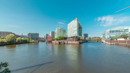 Obraz premium Panorama showing Hamburg HafenCity skyline timelapse at Ericusgraben with a view of modern Spiegel office buildings