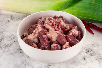 Raw chicken hearts in the bowl