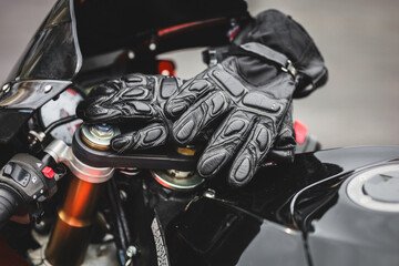 Motorcycle gloves on a street bike 