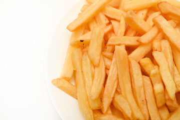 Fried potato. French fries on a white plate. Fast food.