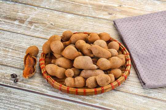 Tropical exotic Tamarind fruit heap