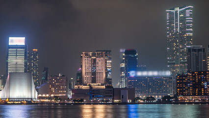 Obraz premium Hong Kong Cultural Centre with colorful light projection on its wall timelapse hyperlapse.