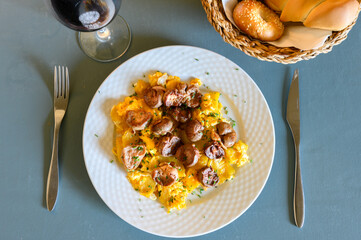 A plate of food with a fork and knife on it