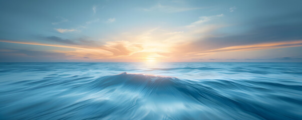 Obraz premium The ocean is calm and the sun is setting