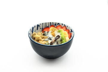 A bowl of food with fruit and nuts