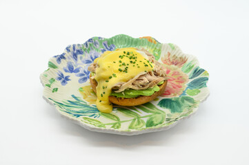 A plate of food with a yellow sauce on top