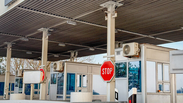 Modern border checkpoint with stop sign, travel and transportation security, international boundaries, customs control