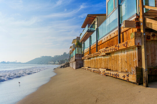 Beautiful Beachfront Homes Along Malibu Shoreline with Crystal Blue Waters - Powered by Adobe
