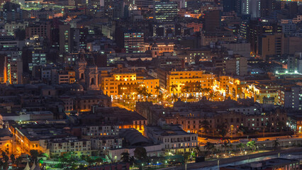 Fototapeta premium Aerial top view of Lima main square from San Cristobal hill day to night timelapse, government palace of Peru and cathedral church.