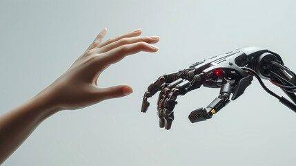 Robotic arm and human arm reaching out to each other