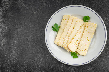 Cheese slices tartiflette soft cheese tasty fresh delicious gourmet food background on the table rustic food top view copy space