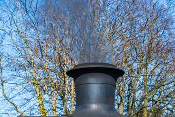 Steam rising out of a steam train chimney stack, locomotive engine exhaust cylinder