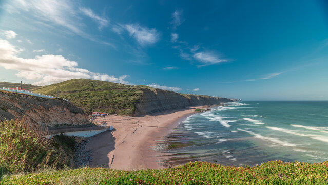 Panorama showing Magoito Beach on Atlantic ocean aerial timelapse, beautiful sandy beach on Sintra coast, Lisbon district, Portugal