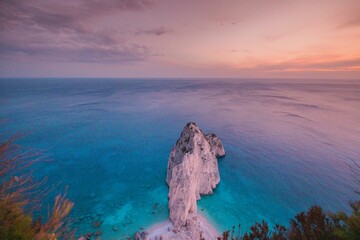 Experience the hidden gems of Zakynthos as the sun sets over the Ionian Sea