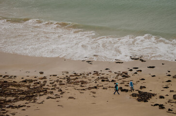 Two people in Lourtuais beach. Cape Erquy. Cotes-d'Armor department. Brittany. France.