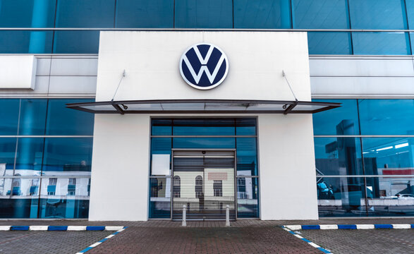 Seville, Spain; 02-15-2025: Exterior view of a Volkswagen dealership with logo sign on facade.