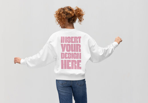 Mockup of Redhead Woman in Casual Jumper With Arms Raised From Behind. PSD ready to customize with your design