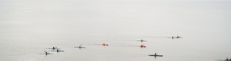 Kayaking in Summer on the Sea with Paddles and Boats