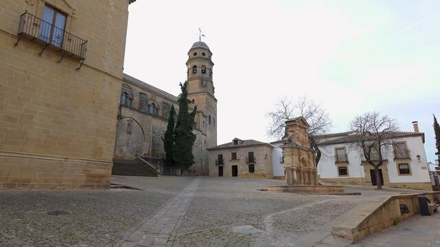 Monumental complex of the city of Baeza with its medieval cathedral and stone fountain, Andalusia.