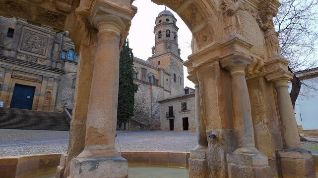 Monumental complex of the city of Baeza with its medieval cathedral and stone fountain, Andalusia.