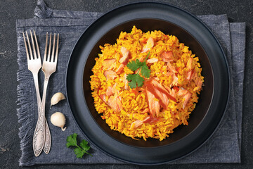 hot smoked salmon kedgeree in a black bowl